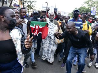 Protesters march along Moi Avenue in Nairobi CBD